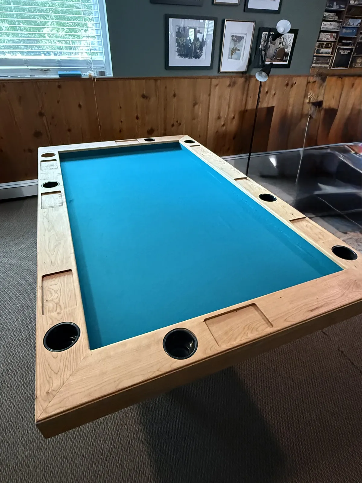Custom gaming table with blue felt surface maple rails and cup holders